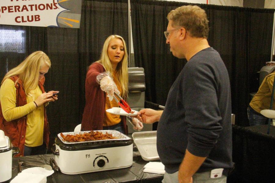 Iowa States Farm Operations Club serves up some bacon samples for attendees of the annual Bacon Expo at Hansen Agriculture Student Learning Center on Oct. 6. Many food vendors and restaurants attended the expo hoping to claim the Peoples Choice Award for best bacon at the Expo. 