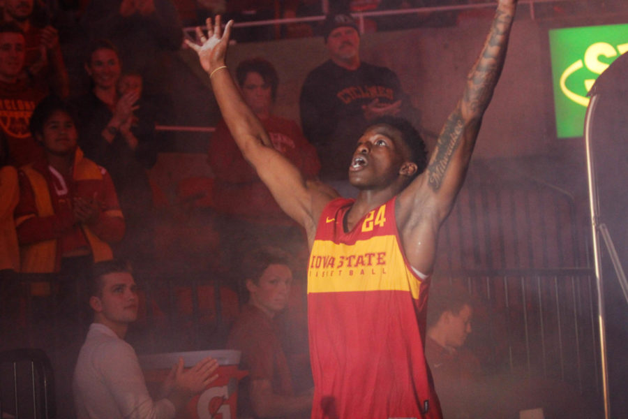 Sophomore Terrence Lewis greets the crowd as he walks on to the court during Hilton Madness at Hilton Coliseum on Oct. 12.