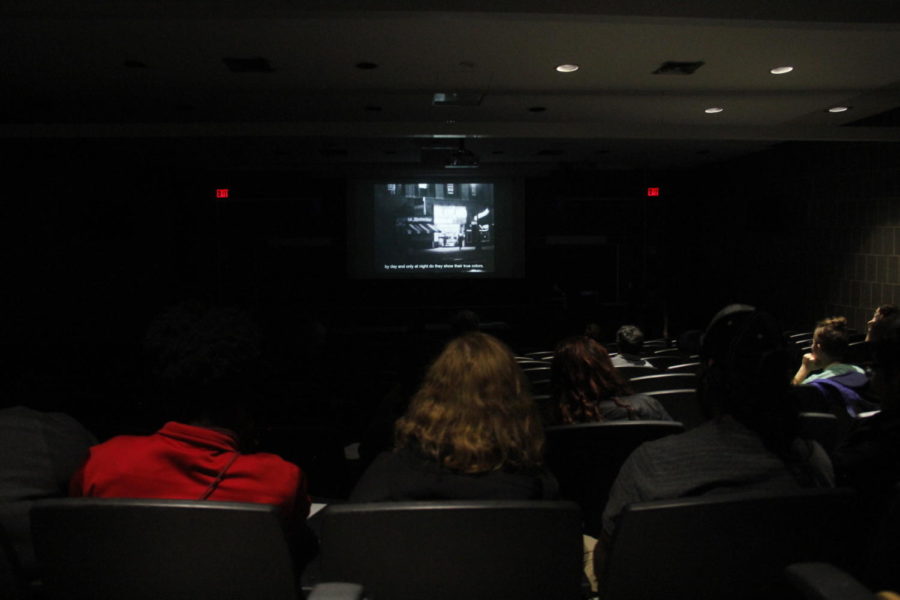 Students watch the screening of the documentary Screaming Queens for LGBTQIA History Month in Carver Hall on Oct. 10.