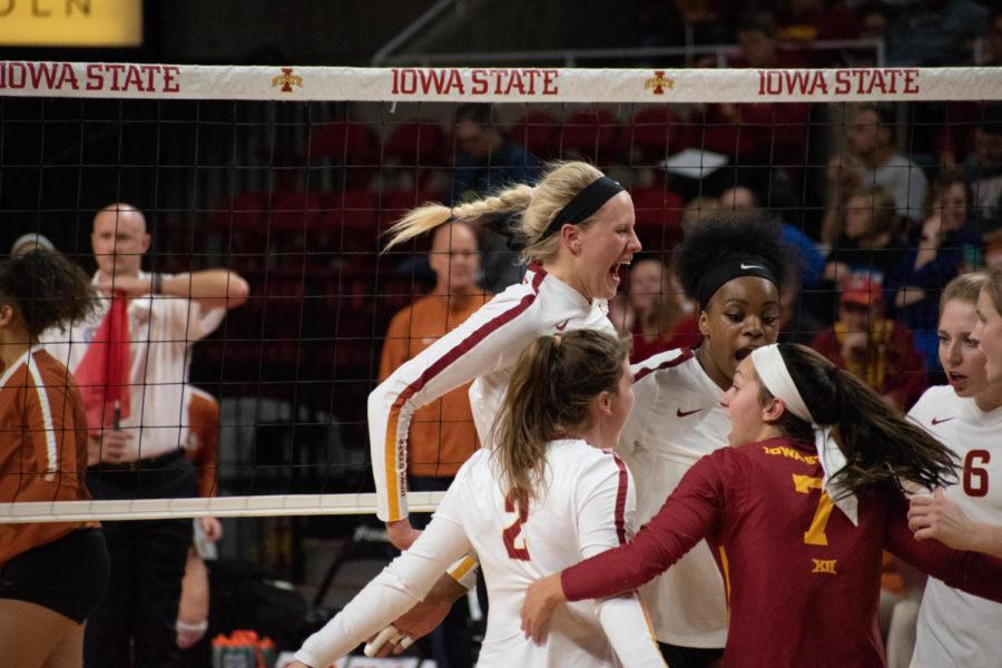 Cyclone volleyball team celebrating after scoring Oct. 24 at Hilton Coliseum. The Cyclones lost to Texas 3-0. 