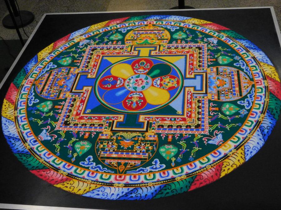 The finished Mandala Sand painting by the Tibetan Monks before they start their closing ceremony in the Main Lounge of the Memorial Union on Sept. 28. The outer layer is the map of the mandala, the inner layer is the human mind while the center layer is the energies of the human body.