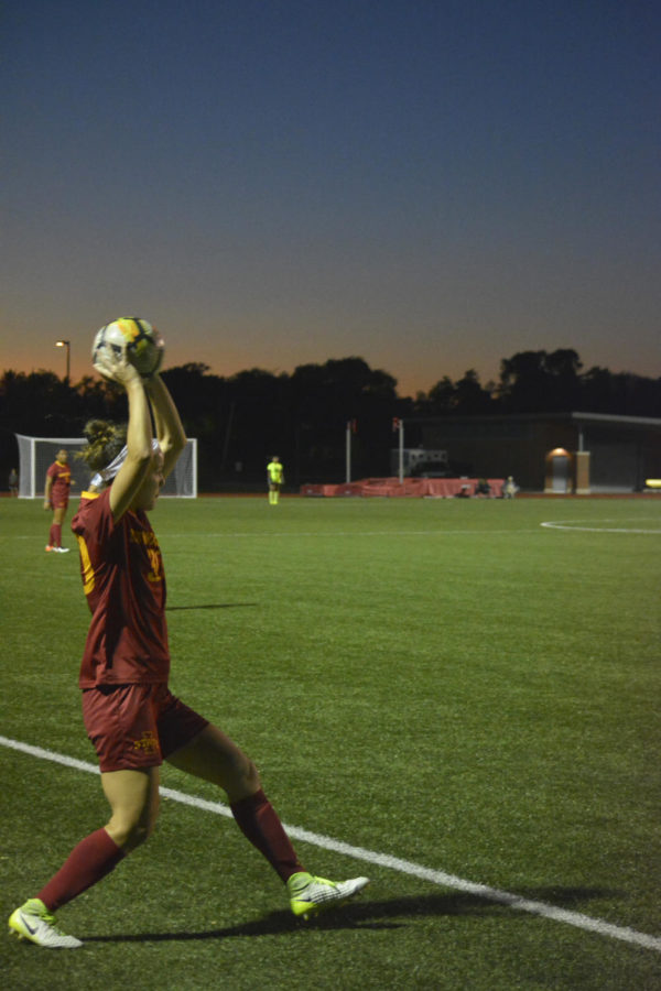 Riley Behan, midfielder/defender, throws the ball to her teammates during the home opener for the Big 12 conference game versus Kansas on Sept. 29. The Iowa State soccer team lost 2-1.