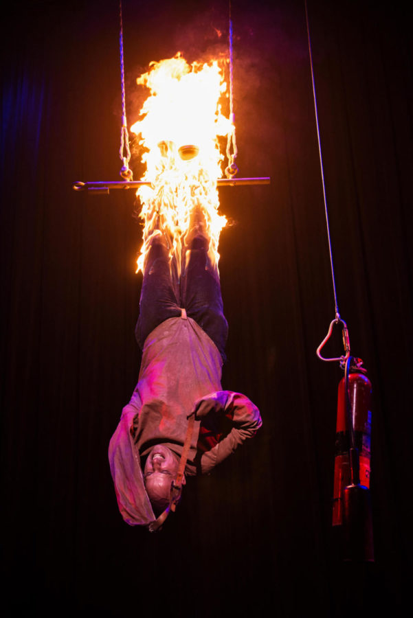 Jonathan Goodwell, The Daredevil, attempting to escape a burning straight jacket at a previous show.