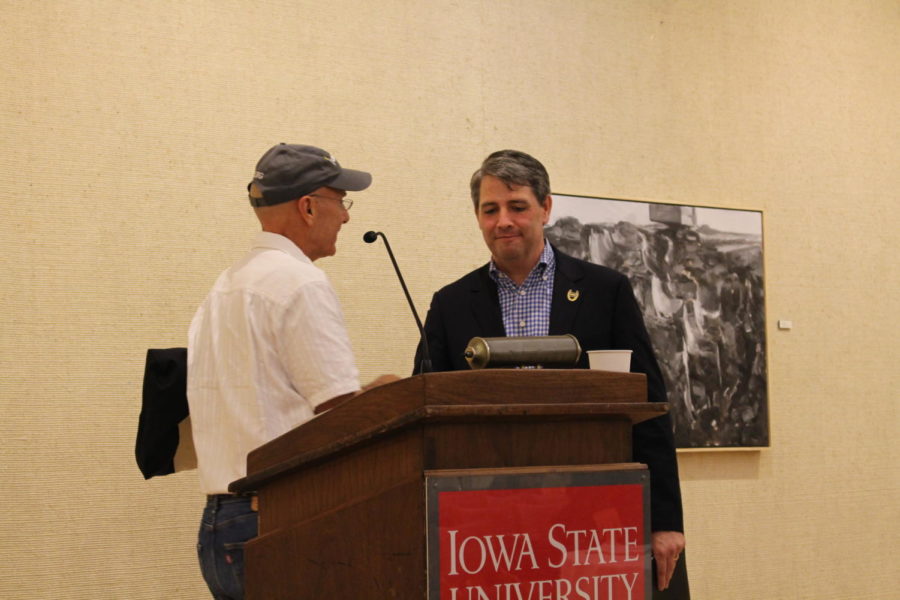 Tim Gannon and Rick Stewart shake hands after the Iowa Secretary of Agriculture Debate held in the Memorial Union Oct. 3. 