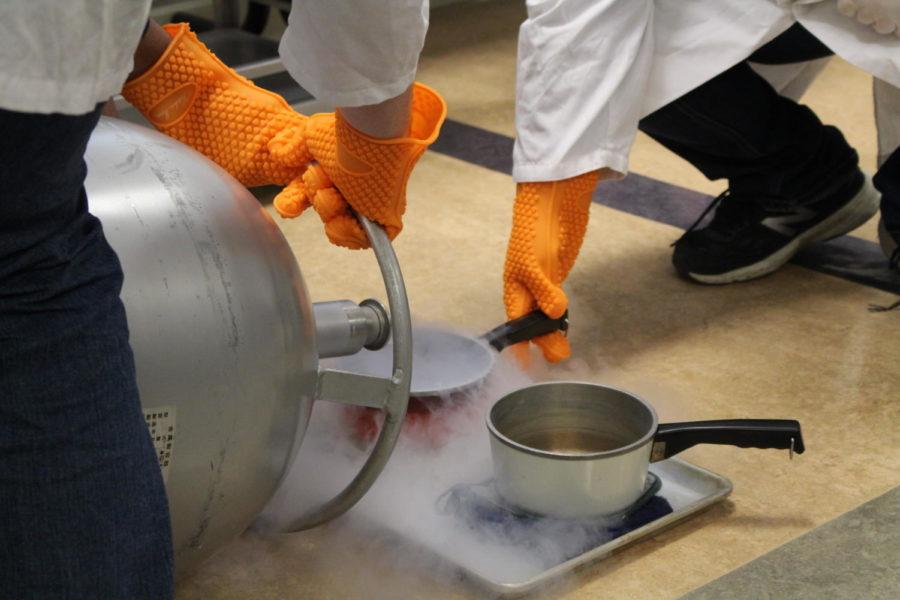Liquid nitrogen at -320 degrees Fahrenheit gets poured into a saucepan to get mixed in with the heavy cream, milk, sugar, and flavoring to create liquid nitrogen ice cream. The event was held by the Food Science Club on Oct. 11 in MacKay Hall for Human Sciences week.