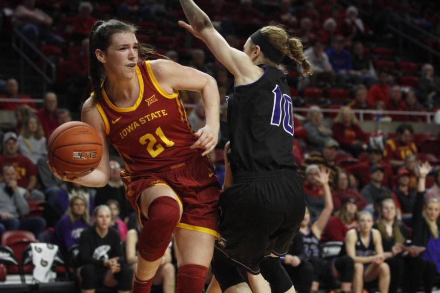 Senior Bridget Carleton looks for a teammate to pass to during the game against the Winona State Warriors at Hilton Coliseum on Nov. 4. The Cyclones won 73-39.