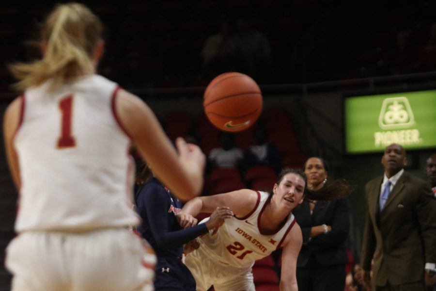 Senior guard Bridget Carleton passes to sophomore forward Madison Wise during the game against Auburn at Hilton Coliseum on Nov. 13. The Cyclones won the semifinal game 67-64 of the WNIT (Women’s National Invitation Tournament) tournament.
