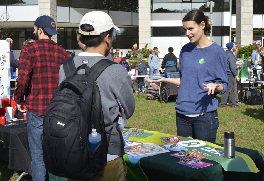 Kara Gardiner, then-Oxfam America vice president, talks with a student about ways their student organization works toward sustainability during National Campus Sustainability Day on Oct. 26, 2017, outside Parks Library.