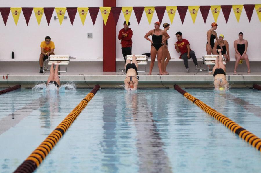 Junior+Kami+Pankratz+%28left%29%2C+junior+Emma+Ruehle+%28middle%29+and+freshman+Lucia+Rizzo+%28right%29+being+swimming+the+200M+during+the+Cardinal+and+Gold+swim+meet+at+Beyer+Hall+on+Oct.+12.