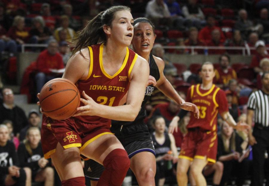 Senior Bridget Carleton looks for a teammate to pass to during the game against the Winona State Warriors at Hilton Coliseum on Nov. 4. The Cyclones won 73-39.