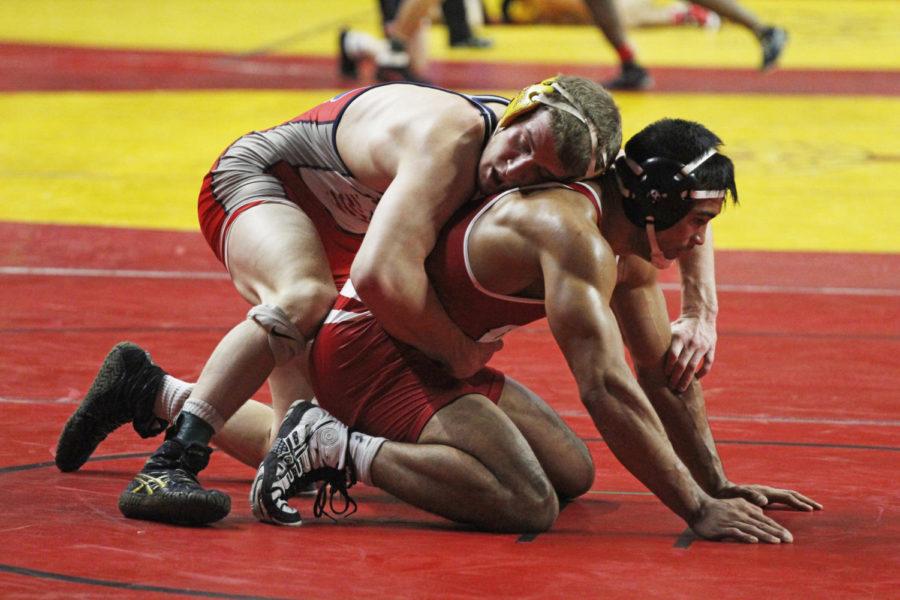 Redshirt junior Brady Jennings takes on another wrestler during the Harold Nichols Cyclone Open in Hilton Coliseum on Nov. 3. 52 schools competed during this tournament.
