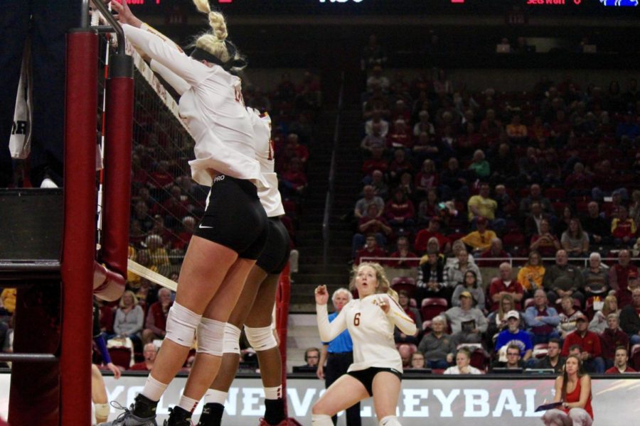 #14 Jess Schaben and #10 Grace Lazard work together to block a ball at the net. The Cyclones won Friday night, 3-1 against Kansas State. 