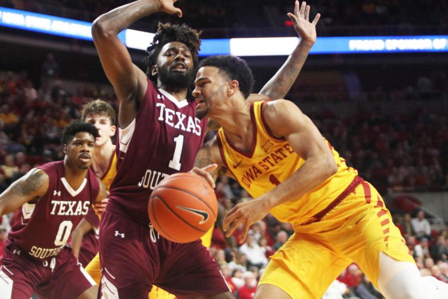 Senior Nick Weiler-Babb passes Texas Southern senior Jeremy Combs on his way to attempt a basket for the Cyclones during the game against Texas Southern at Hilton Coliseum on Nov. 12. The Cyclones won 85-73.