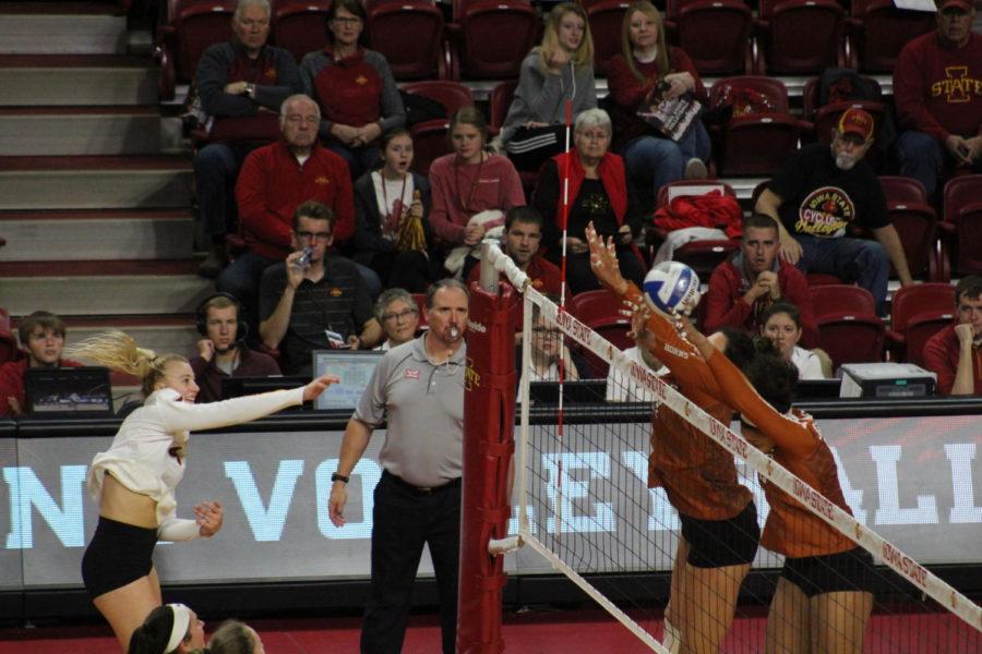 Junior Josie Herbst spikes the ball over the net at the Iowa State vs. Texas volleyball game at the Hilton Coliseum on Oct. 24. The Cyclones fell to the Longhorns 0-3. 