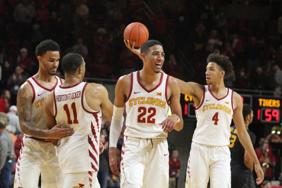 Teammates Tyrese Haliburton (center), George Conditt IV (right) and Talen Horton-Tucker (left), celebrate a Cyclone victory after defeating Mizzou 76-59 at the game in the Hilton Coliseum on Nov. 9.