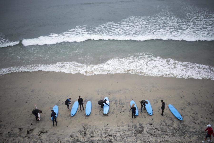 Pictured from above are students shown on the beach readying up to go surf during one of the Outdoor Recreation Programs recent student trips.