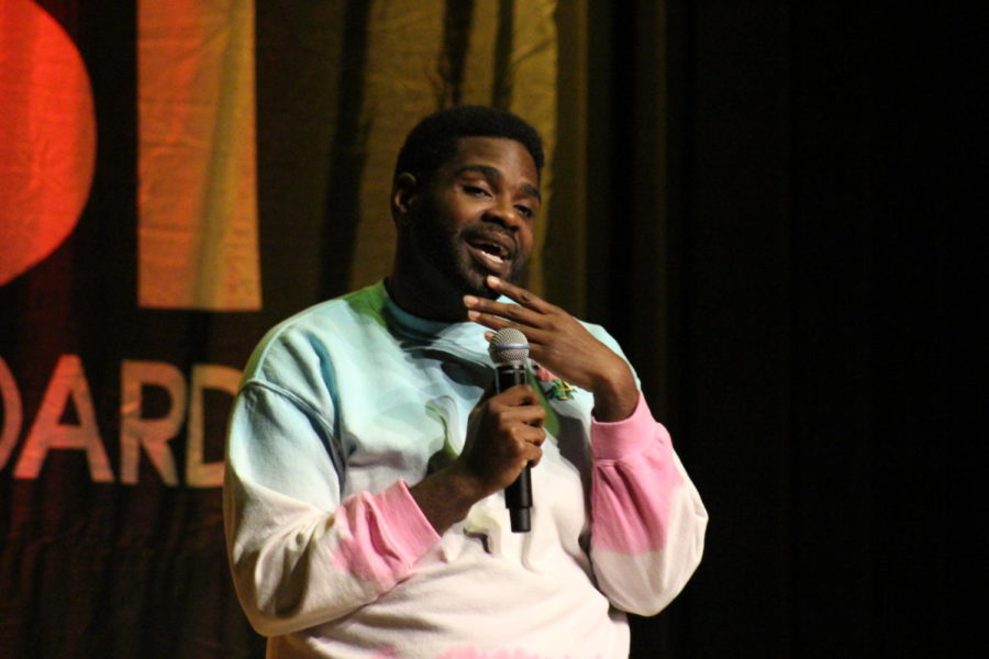 Ron Funches, star in NBCs Undateable, cracks jokes to the audience at ISU AfterDark in the Memorial Union on Nov. 2. Funches joked about Kum & Go, Dewayne the Rock Johnson, Lebron James, a Japanese toilet and more. The Beyoncé for boys, said Funches as he described Dewayne the Rock Johnson.