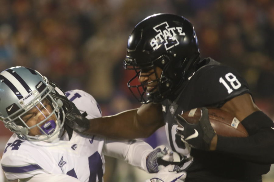 Redshirt junior wide receiver Hakeem Butler stiff arms a Kansas State defender after a catch against the Wildcats on Nov. 24. The Cyclones defeated Kansas State 42-38.