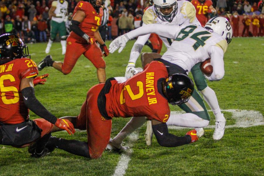 Senior linebacker Willie Harvey tackles one of Baylors players to the ground during the game against Baylor on Nov. 10 at Jack Trice Stadium. The Cyclones beat the Bears 28-14.