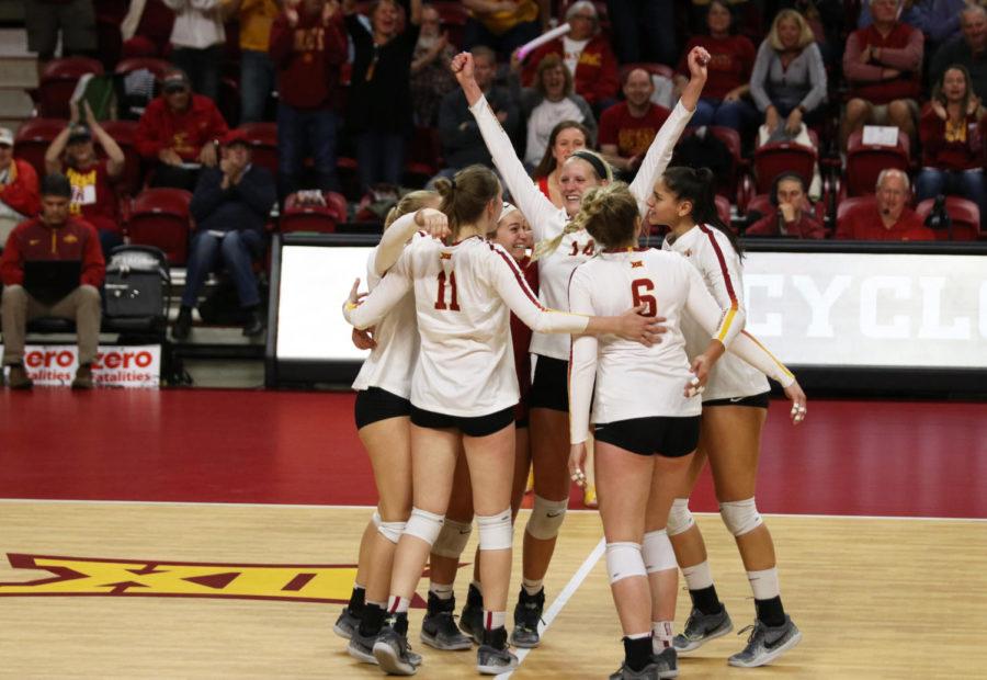 Members+of+the+Iowa+State+volleyball+team+celebrate+scoring+a+point+during+their+game+against+Kansas+State+at+Hilton+Coliseum+on+Oct.+26.+The+Cyclones+won+3-1.