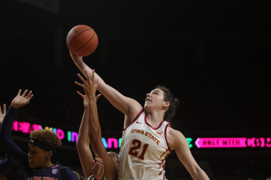 Senior guard Bridget Carleton goes for a rebound during the game against Auburn at Hilton Coliseum on Nov. 13. The Cyclones won the semifinal game 67-64 of the WNIT (Women’s National Invitation Tournament) tournament.