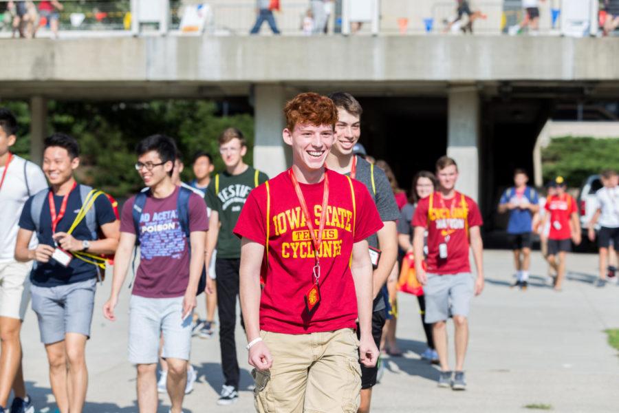 Incoming freshmen smile as they walk toward the tunnel of DIS leaders Aug. 16, 2018, during the Destination Iowa State Kickoff event.