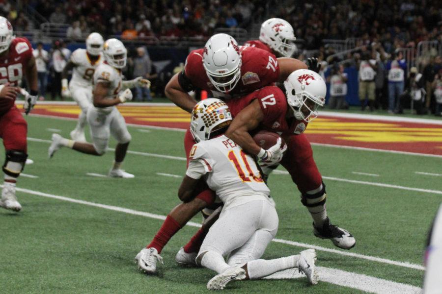 Brian Peavy takes down a Washington State Player at the Alamo Bowl game on Dec. 28. The Cyclones fell to the Cougars 28-26.