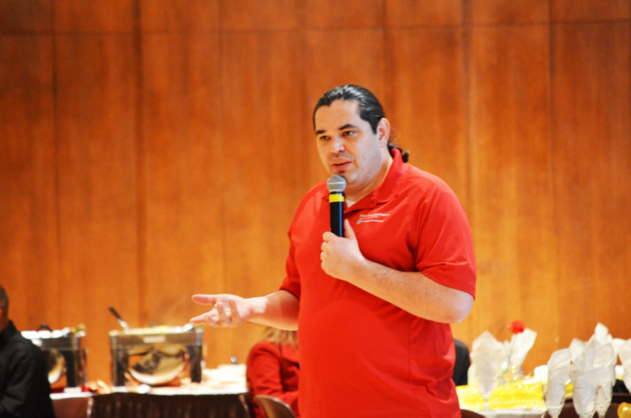John-Paul Chaisson-Cardenas speaks about his experiences leading programs and organizations in anti-poverty at Noche de Cultura in the Sun Room of the Memorial Union on Oct. 24, 2014.