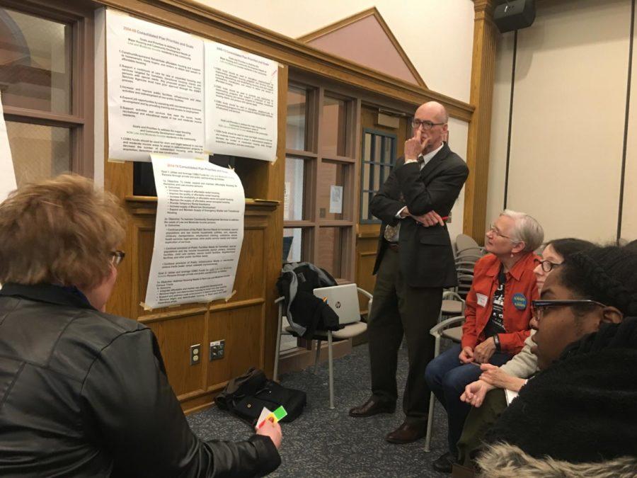 Ames Mayor John Haila works with residents to discuss housing concerns. 