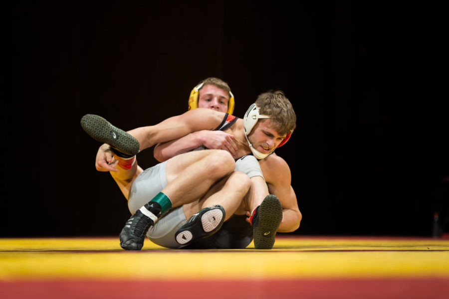 Redshirt Sophomore Brady Jennings wrestles Nate Higgins durring the Iowa State vs SIU-Edwarsville match in Stephens Auditorium Nov. 11. The Cyclones won nine of the ten matches over the Cougars.