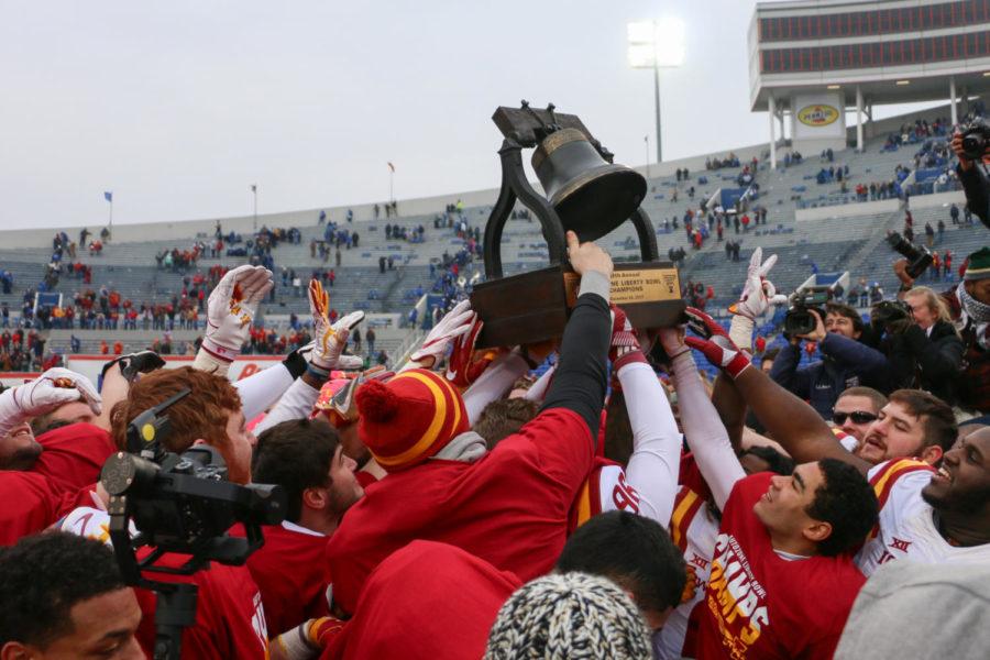 Iowa State football players celebrate their 21-20 win over Memphis by ringing the Liberty Bell trophy Dec. 30, 2017 after the 59th Annual AutoZone Liberty Bowl in Memphis, Tenn.