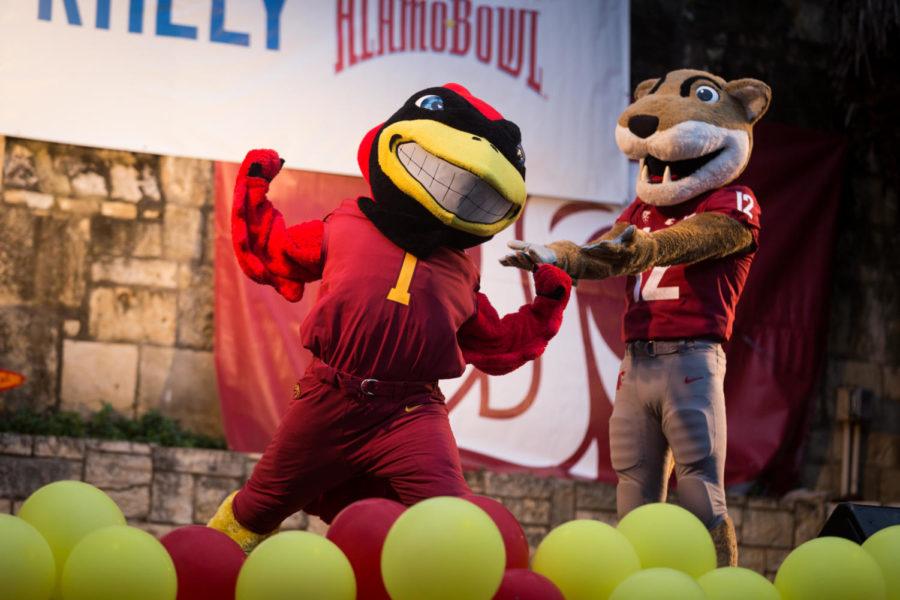 The Washington State and Iowa State Mascots get the crowd warmed up before the start of the Rudy's Bar-B-Q Pep Rally Dec. 26.