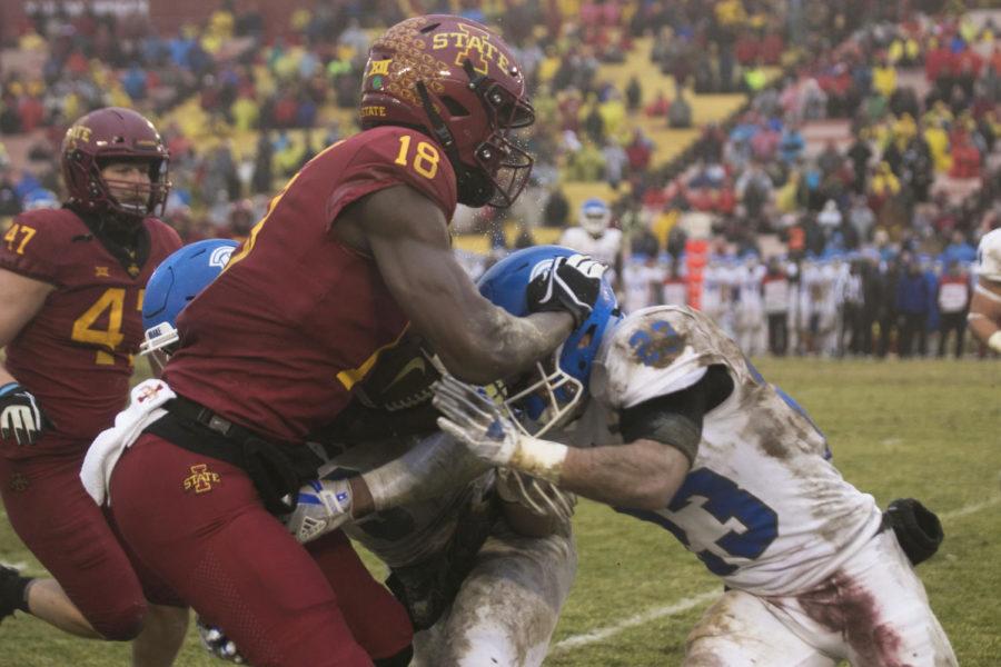 Wide receiver Hakeem Butler goes up against Drake University defensive back Sean Lynch during the game against Drake University at Jack Trice Stadium on Dec. 1. The Cyclones won 27-24.