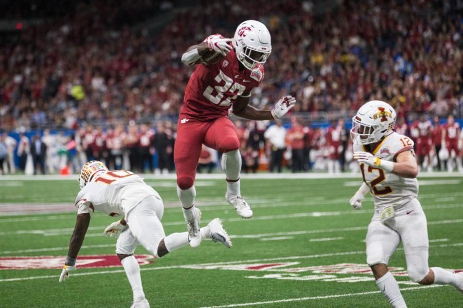 Member of the Washington State Football Team jumps in the air during the first half of the Valero Alamo Bowl Game Dec 28.