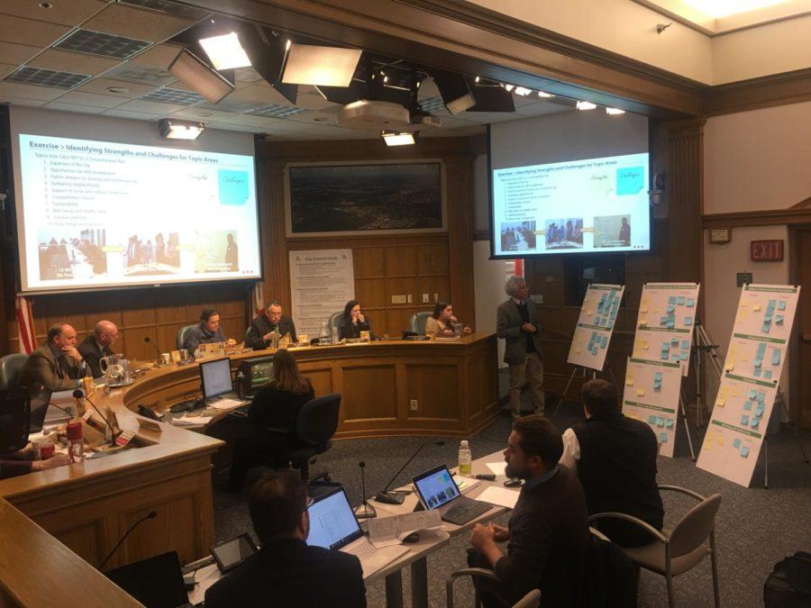 RDG Planner Marty Shukert (right of the dais) walks through different strengths and challenges Council members wrote down. 