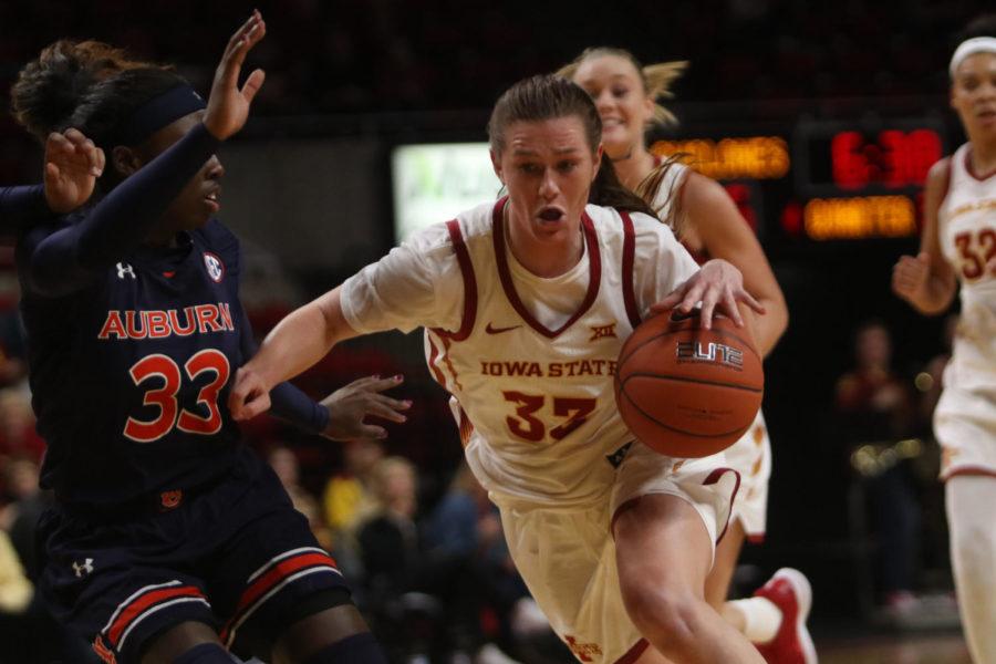 Redshirt senior guard Alexa Middleton drives the ball down the court during the game against Auburn at Hilton Coliseum on Nov. 13. The Cyclones won the semifinal game 67-64 of the WNIT (Women’s National Invitation Tournament) tournament.
