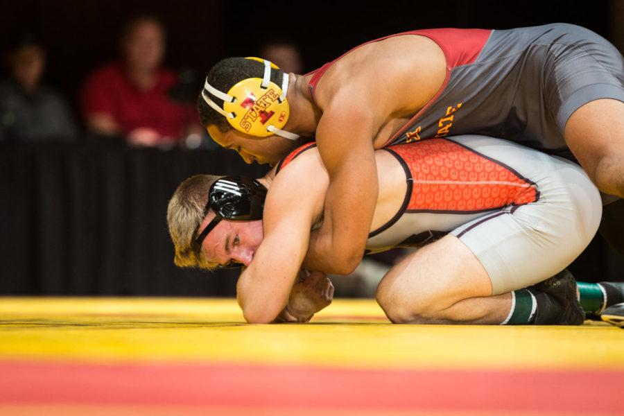 Freshman Marcus Coleman wrestles Kevin Gschwendtner durring the Iowa State vs SIU-Edwarsville match in Stephens Auditorium Nov. 11. The Cyclones won nine of the ten matches over the Cougars.