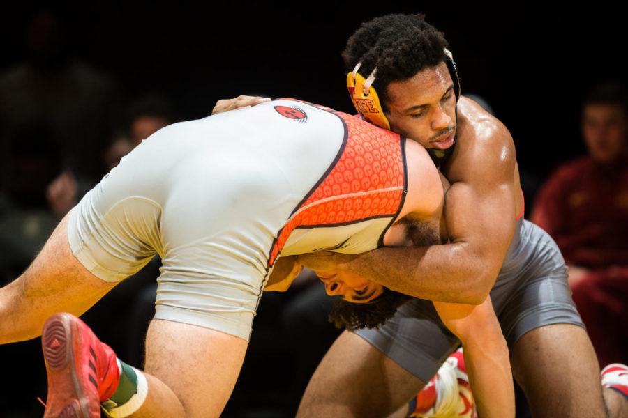 Sam Colbray wrestles Sergio Villalobos during the Iowa State vs SIU-Edwardsville match in Stephens Auditorium Nov. 11. The Cyclones won nine of the 10 matches over the Cougars.