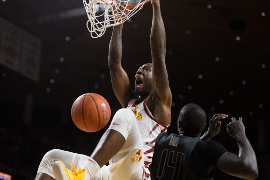 Sophomore forward Cameron Lard dunks during the Iowa State vs Oklahoma State basketball game on Jan. 19 in Hilton Coliseum. The Cyclones defeated the Cowboys 72-59.