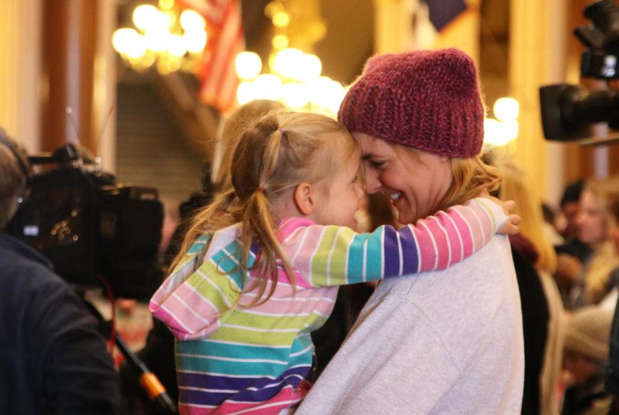 Josie Black (left), 5, and mother Katie Black (right) embrace during speeches at the 2019 Women’s March Iowa at the Iowa State Capitol in Des Moines on Jan. 19. Cindy Axne, Representative-Elect from the 3rd District and Kirsten Gillibrand, New York Sen., were among those that spoke during the event. Spoken word poetry was also performed by Ruby Griffin and LaNeeta Burgs from Movement 515, an urban arts community that meets twice a week to collaborate on spoken word poetry and graffiti art.