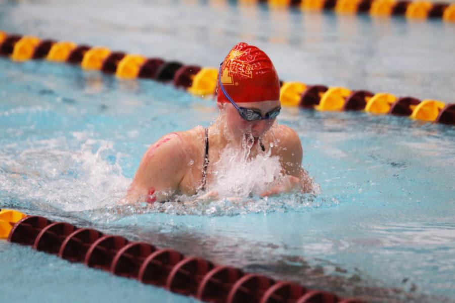 Sophomore Bryn Ericksen swims in lane 5 during the Women 100 Breaststroke competition during the Cardinal and Gold swim meet at Beyer Hall on Oct. 12.