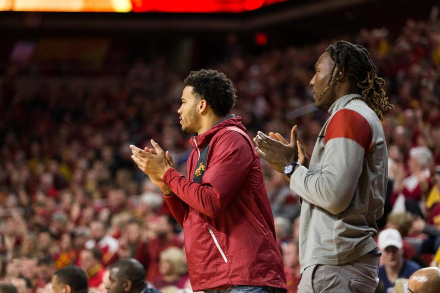 Redshirt+junior+Nick+Weiler-Babb+and+sophomore+Solomon+Young+cheer+on+their+teammates+from+the+bench+due+to+injuries+during+Iowa+States+senior+night+game+against+Oklahoma+State+on+Feb.+27+in+Hilton+Coliseum.+The+Cowboys+defeated+the+Cyclones+80-71.