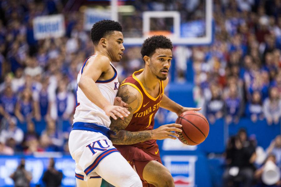 Senior guard Nick Weiler-Babb looks for an open pass during the first half of the Iowa State vs Kansas basketball game in Allen Fieldhouse on Jan. 21. The Jayhawks defeated the Cyclones 80-76.