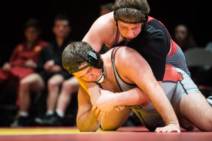 Redshirt Freshman Gannon Gremmel wrestles Tommy Helton durring the Iowa State vs SIU-Edwarsville match in Stephens Auditorium Nov. 11. The Cyclones won nine of the ten matches over the Cougars.