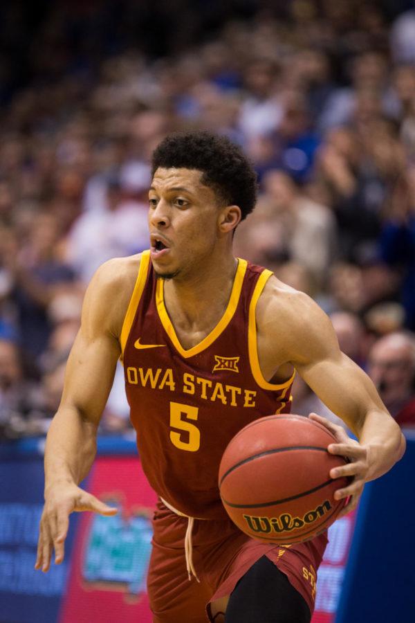 Sophomore guard Lindell Wigginton drives to the hoop during the Iowa State vs Kansas basketball game in Allen Fieldhouse Jan. 21. The Jayhawks defeated the Cyclones 80-76.