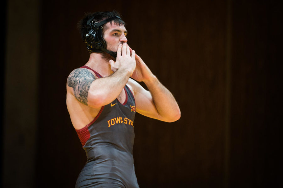 Redshirt Senior Willie Miklus wrestles Christian Dulaney during the Iowa State vs SIU-Edwardsville match in Stephens Auditorium Nov. 11. The Cyclones won nine of the ten matches over the Cougars.