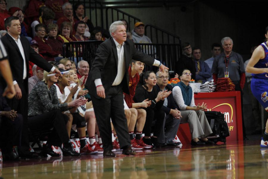 Iowa State coach Bill Fennelly gives direction to his team on defense following a made shot against Kansas.