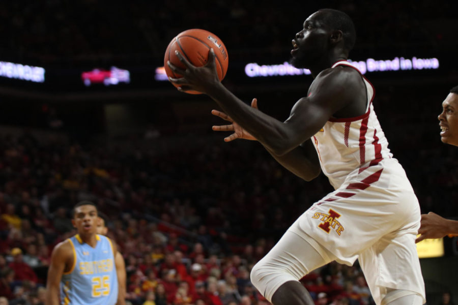 Redshirt senior Marial Shayok goes up for a basket during the game against the Southern University Jaguars on Dec. 9 at Hilton Coliseum. The Cyclones ended the game with a win of 101-65.