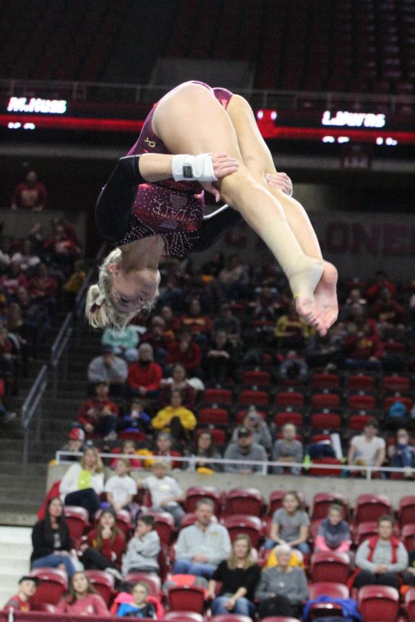 Iowa State Gymnastics junior Laura Burns executes a perfectly stuck piked double salto in her floor routine to earn a 9.875 for the Cyclones at the meet against Lindenwood University at Hilton Coliseum on Jan. 27.