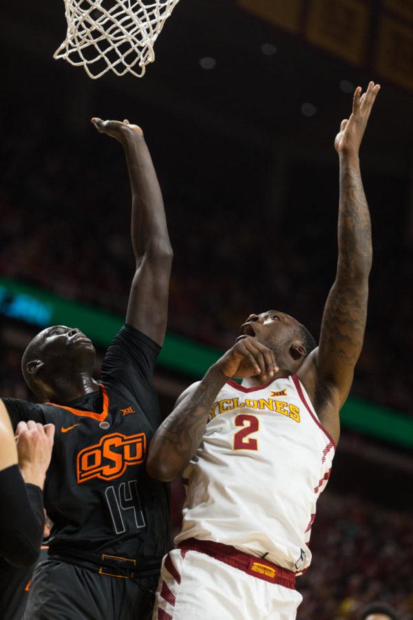 Sophomore forward Cameron Lard goes up for a rebound during the Iowa State vs Oklahoma State basketball game on Jan. 19 in Hilton Coliseum. The Cyclones defeated the Cowboys 72-59.